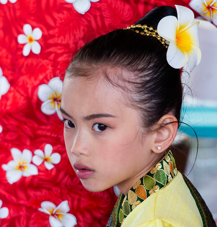 (Rick Egan  |  The Salt Lake Tribune)   Kandra  Konboukay, 7 stands by her mother as she makes a papaya salad, during the Wat Lao Salt Lake Buddharam Utah, New Year Celebration, in West Valley City, 
Sunday, April 28, 2019.


