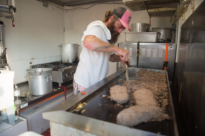 (Rachel Molenda  |  The Salt Lake Tribune)  Stephen Wallace, of Kountze, Texas, browns ground beef for dinner at the Sunset Grill mobile kitchen on Tuesday, Sept. 5, 2017.