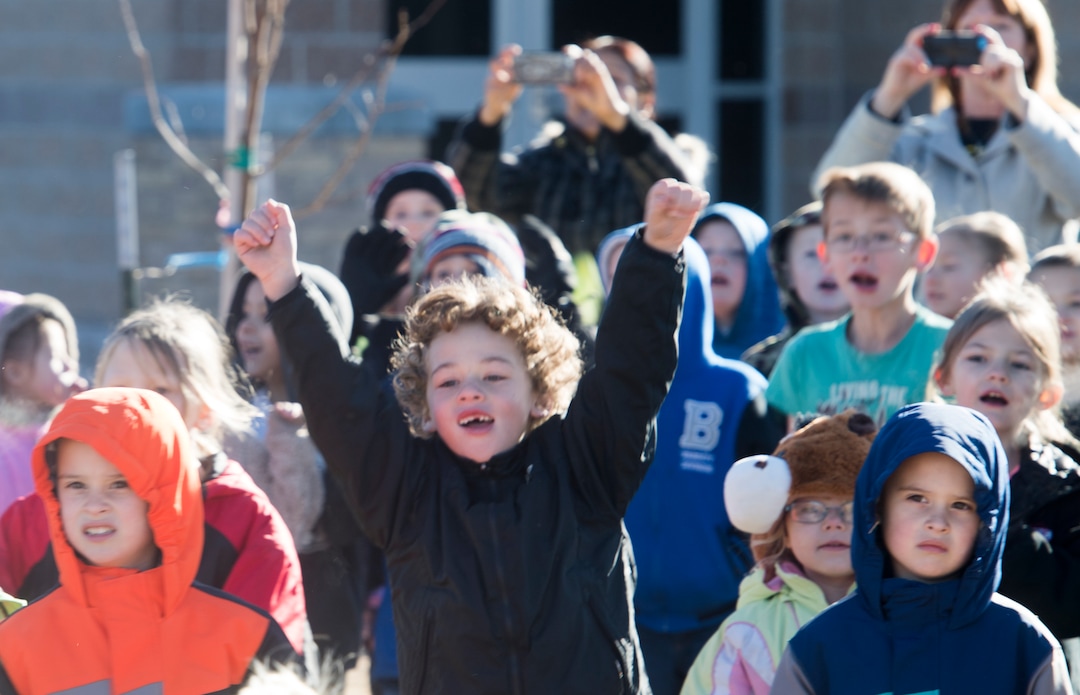 (Rick Egan  |  The Salt Lake Tribune) First grader Zaityn Lujan (center) cheers as Santa and Mrs Claus arrive in a helicopter, at Centennial Elementary School, in Roosevelt, Utah, as volunteer pilots from the Utah Wing of Angel Flight West,  brought school supplies and gifts to students  on their annual Santa Flight. Friday, December 8, 2017.