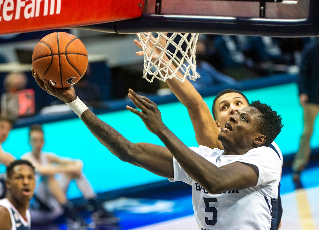 (Rick Egan | The Salt Lake Tribune)  Brigham Young forward Gideon George (5) gets past Gonzaga Bulldogs guard Jalen Suggs (1) to score for the Cougars, in West Coast Conference Basketball action between the Brigham Young Cougars and the Gonzaga Bulldogs at the Marriott Center in Provo, on Monday, Feb. 8, 2021.