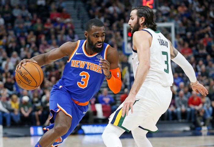New York Knicks forward Tim Hardaway Jr. (3) drives around Utah Jazz guard Ricky Rubio (3) in the first half during an NBA basketball game Friday, Jan. 19, 2018, in Salt Lake City. (AP Photo/Rick Bowmer)