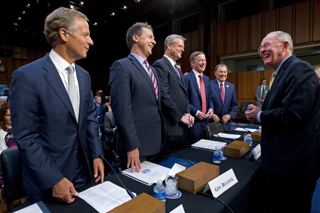 Governors from left; Bill Haslam of Tennessee, Steve Bullock of Montana, Charlie Baker of Massachusetts, John Hickenlooper of Colorado and Gary Herbert of Utah are greeted by Senate Health, Education, Labor, and Pensions Committee Chairman Sen. Lamar Alexander, R-Tenn., right, during a hearing to discuss ways to stabilize health insurance markets, on Capitol Hill in Washington, Thursday, Sept. 7, 2017. ( AP Photo/Jose Luis Magana)