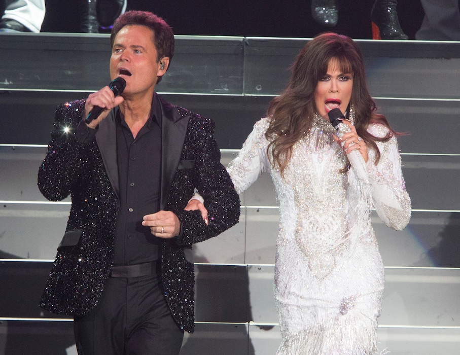 (AP File | Owen Sweeney/Invision) This Aug. 22, 2017 file photo shows Donny Osmond, left, and Marie Osmond performing at the Santander Arena in Reading, Pa. One of the producers of their 1978-79 ABC variety show, Mary Krofft, recently died at the age of 86.