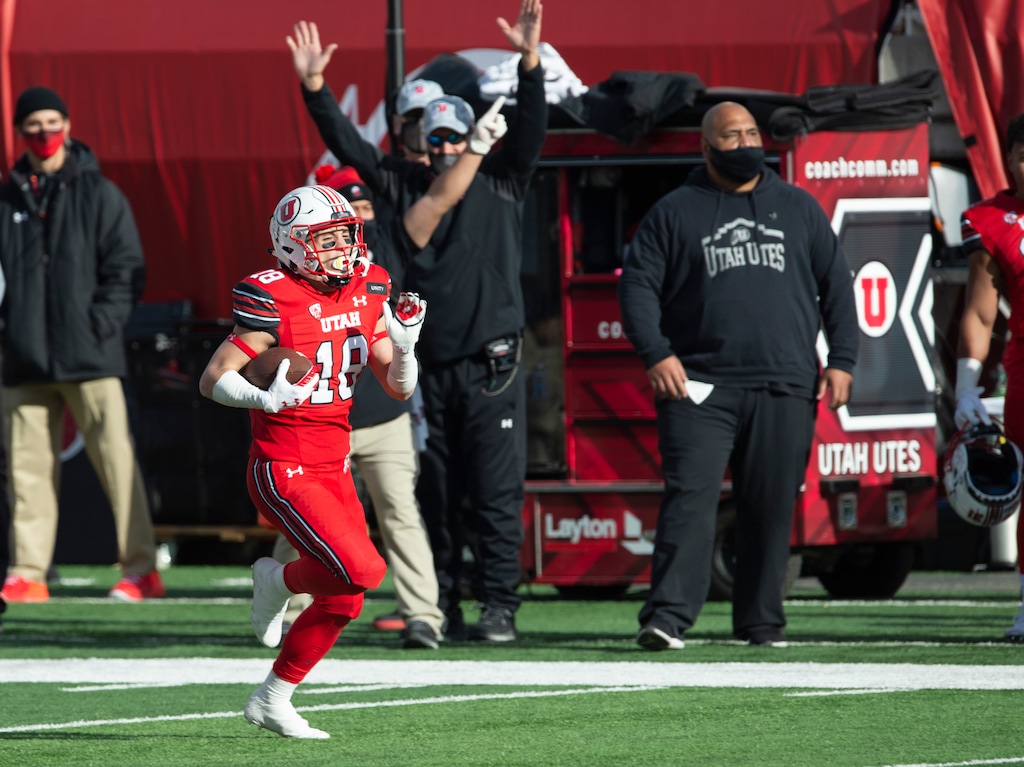 (Rick Egan | The Salt Lake Tribune) Utah Utes wide receiver Britain Covey (18), grabs a pass and scores on a 91-yard touchdown play, in PAC-12 football acton between Utah Utes and Washington State Cougars at Rice-Eccles Stadium on Saturday, Dec. 19, 2020.