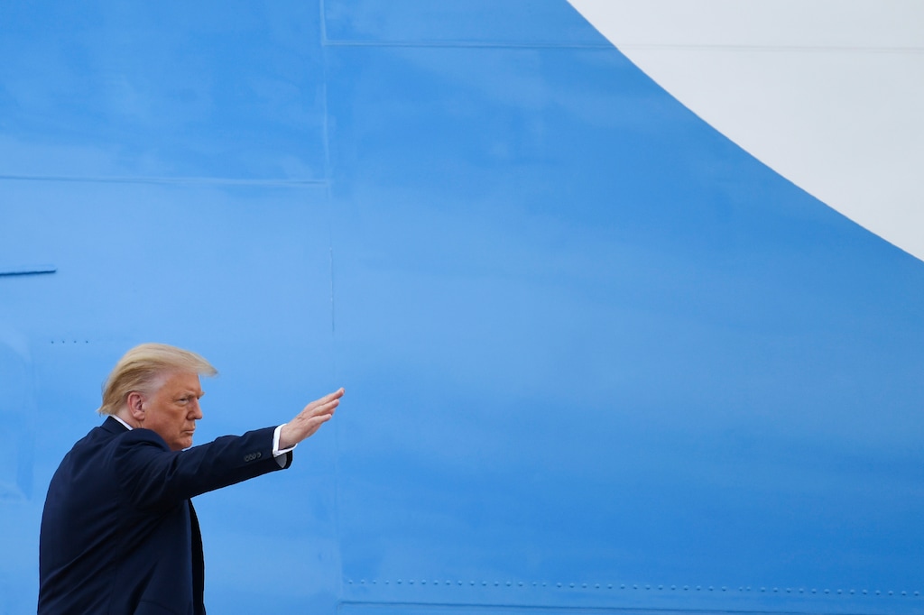 (Susan Walsh | AP file photo)  President Donald Trump waves from the top of the steps of Air Force One at Andrews Air Force Base in Md., Friday, July 10, 2020.