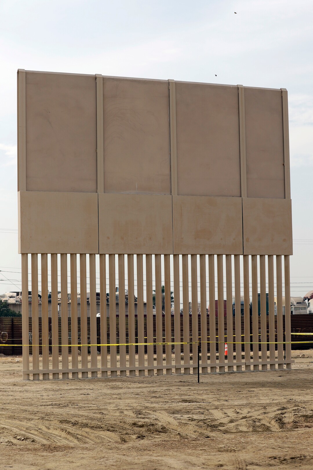 (Gregory Bull | Associated Press file photo)  In this Oct. 19, 2017 file photo, an unfinished border wall prototype stands near the border with Tijuana, Mexico, in San Diego. A U.S. official says recent testing of prototypes of President Donald Trump's proposed wall with Mexico found their heights should stop border crossers. U.S. tactical teams spent three weeks trying to breach and scale the models in San Diego. An official with direct knowledge of the results said they point to see-through steel barriers topped by concrete as the best design. The official spoke to The Associated Press on condition of anonymity because the information is not authorized for release.