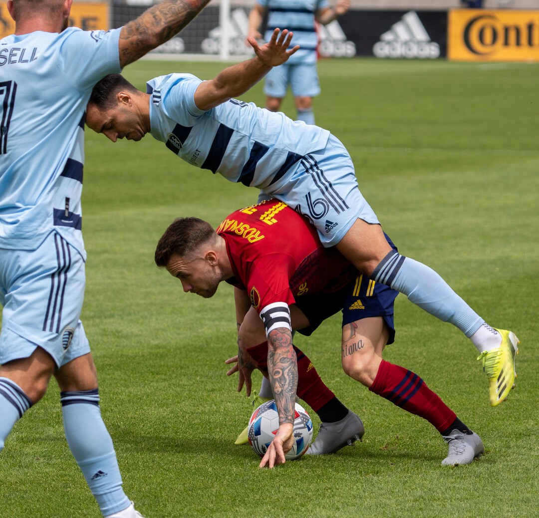 (Rick Egan | The Salt Lake Tribune) Sporting Kansas City defender Luis Martins (36) falls on top of Real Salt Lake midfielder Albert Rusnak (11), in MLS action between Real Salt Lake and Sporting Kansas City at Rio Tinto Stadium, on Saturday, May 1, 2021.