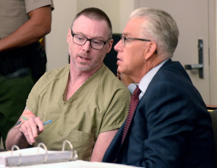 (Al Hartmann  |  The Salt Lake Tribune)       
Craig Crawford, speaks with defense lawyer Jim Bradshaw in 3rd District Judge James Blanch's courtroom during a three-day sentencing hearing Monday August 28 in Salt Lake City.  Crawford has admitted that he trapped his 72-year-old estranged husband, well-known restaurateur John Williams, inside his home and then set it ablaze last year.
He pleaded guilty in June to first-degree felony counts of aggravated murder and aggravated arson.
The judge will decide whether Crawford will serve life in prison with or without the possibility of parole.