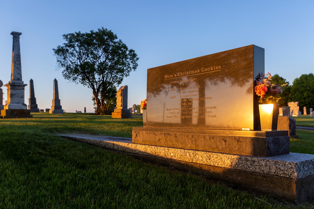 (Rachel Mummey | The New York Times) A German Christmas cookie recipe on the grave of Maxine Kathleen Poppe Menster, in Cascade, Iowa on June 8, 2022. They say you can't take it with you, but recipes often disappear when loved ones die. Some families are finding a novel way to record them for posterity.