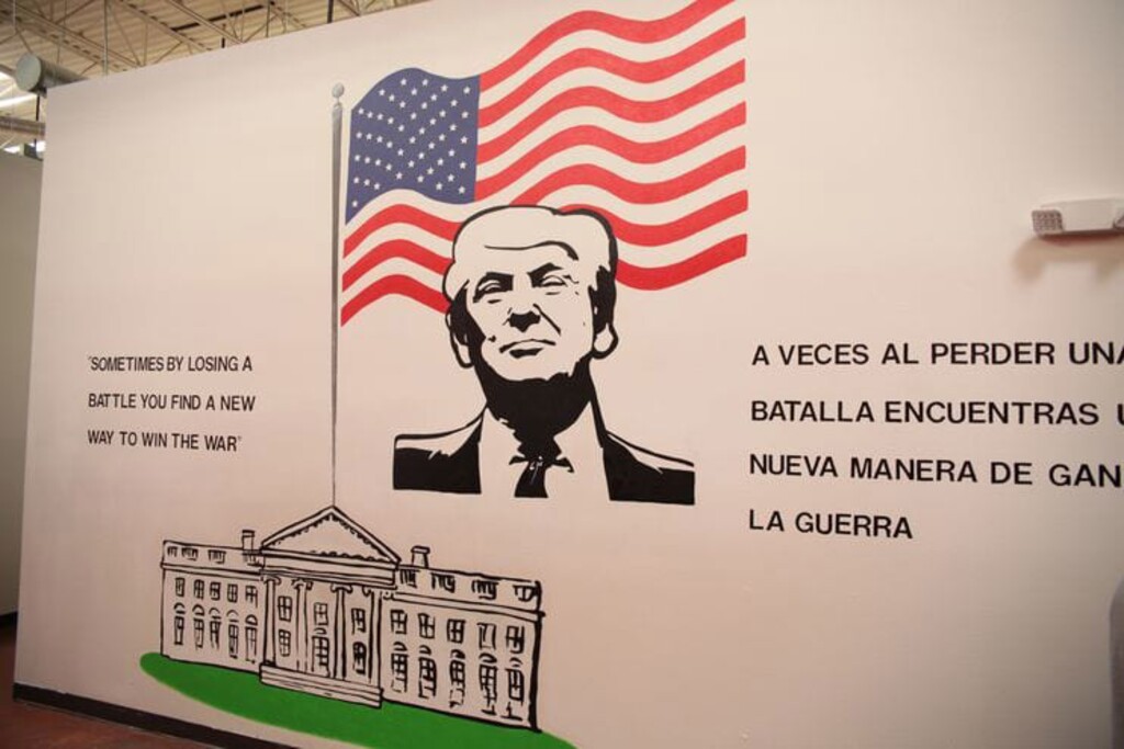 (U.S. Department of Health and Human Services) A mural of President Trump, the first in a series of presidential murals a visitor encounters, features a quote from a tweet he posted in 2014.
