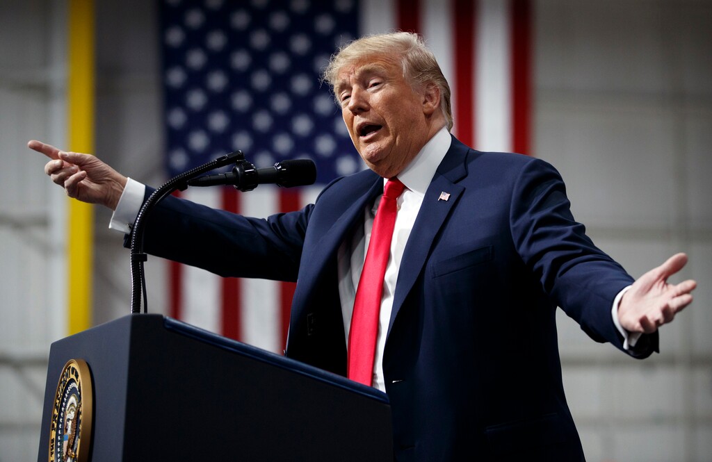 In this March 10, 2018, photo, President Donald Trump speaks at a campaign rally at Atlantic Aviation in Moon Township, Pa. Weeks after prodding lawmakers to stand up to the National Rifle Association,Trump is backing off his call for increasing the minimum age to buy an assault weapon — an idea strongly opposed by the NRA. (AP Photo/Carolyn Kaster)