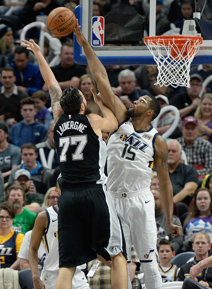 (Francisco Kjolseth  |  The Salt Lake Tribune)  San Antonio Spurs center Joffrey Lauvergne (77) is shut down by Utah Jazz forward Derrick Favors (15) during the second half of the NBA basketball game in Salt Lake City, Thursday, Dec. 21, 2017.