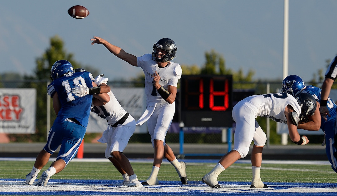 (Scott Sommerdorf   |  The Salt Lake Tribune)   Corner Canyon QB Zach Wilson makes a throw behind his offensive line during first half play. Corner Canyon led Pleasant Grove 14-3 at the half, Friday, August 18, 2017.  led Pleasant Grove 14-3 at the half, Friday, August 18, 2017. 