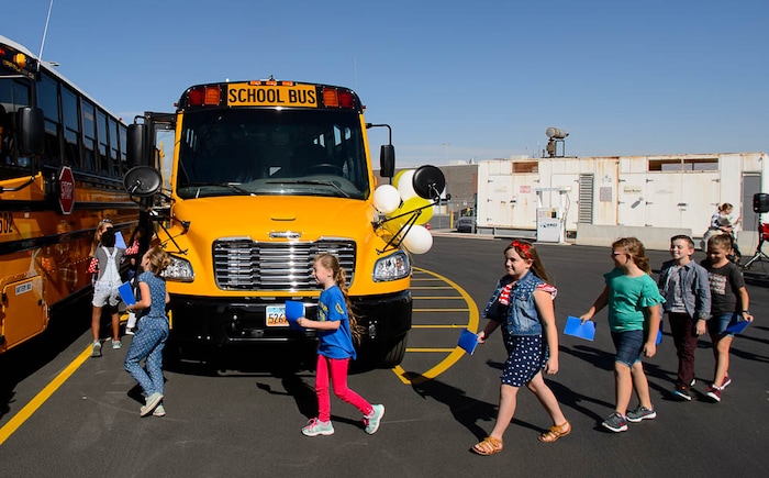 (Trent Nelson | The Salt Lake Tribune)
Fourth graders from Terra Linda Elementary leave at a news conference introducing thirty-six new CNG school buses have been added to the Jordan School District fleet this year, bringing the total to 105, the largest fleet of CNG school buses in Utah. Wednesday Sept. 12, 2018.