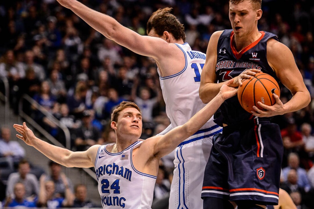 (Trent Nelson | The Salt Lake Tribune)   Brigham Young Cougars guard McKay Cannon (24) reaches for the ball in the hands of St. Mary's Gaels center Jock Landale (34) as BYU hosts the St. Mary's Gaels, NCAA basketball in Provo, Saturday December 30, 2017.