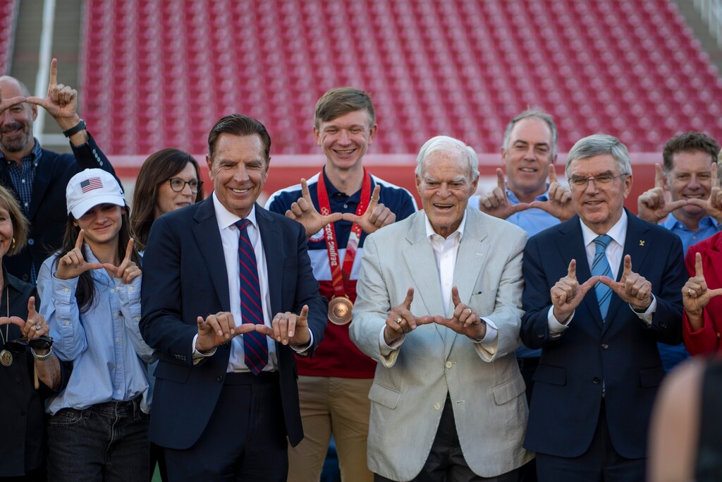 (Rick Egan | The Salt Lake Tribune)  Spence Eccles, center poses for photo with Fraser Bullock, third from left, International Olympic Committee President Thomas Bach, second from right, and his entourage, during a tour of Rice-Eccles Stadium at the University of Utah, on Friday, Sept. 27, 2024.