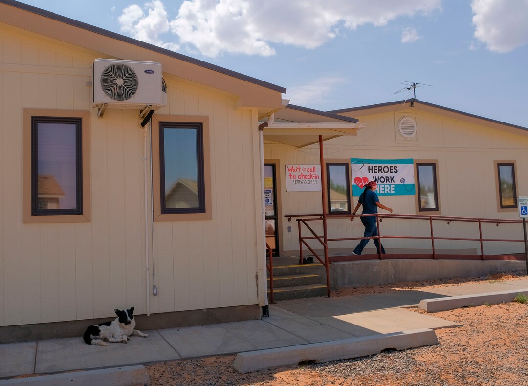 (Leah Hogsten  |  The Salt Lake Tribune) “I love working here,” said Navajo Mountain Clinic medical assistant Sonya Sloan, above, heading out to grab something from her car Aug., 25, 2020. “I love helping my people.” The Navajo Mountain UNHS clinic had to close down in June for two weeks after a staff member tested positive for COVID-19. The clinic currently serves dental patients one at a time and patients who need urgent medical care or coronavirus testing. Staff members deliver medications to patients in their vehicles.