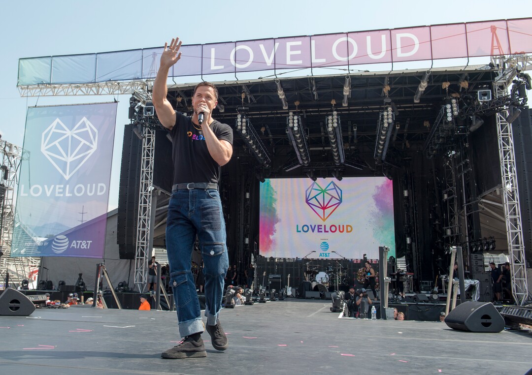 (Rick Egan  |  The Salt Lake Tribune)     Loveloud Founder Dan Reynolds greets the crowd at the start of the Loveloud Festival in the early afternoon, at Rice-Eccles Stadium, Saturday, July 28, 2018.