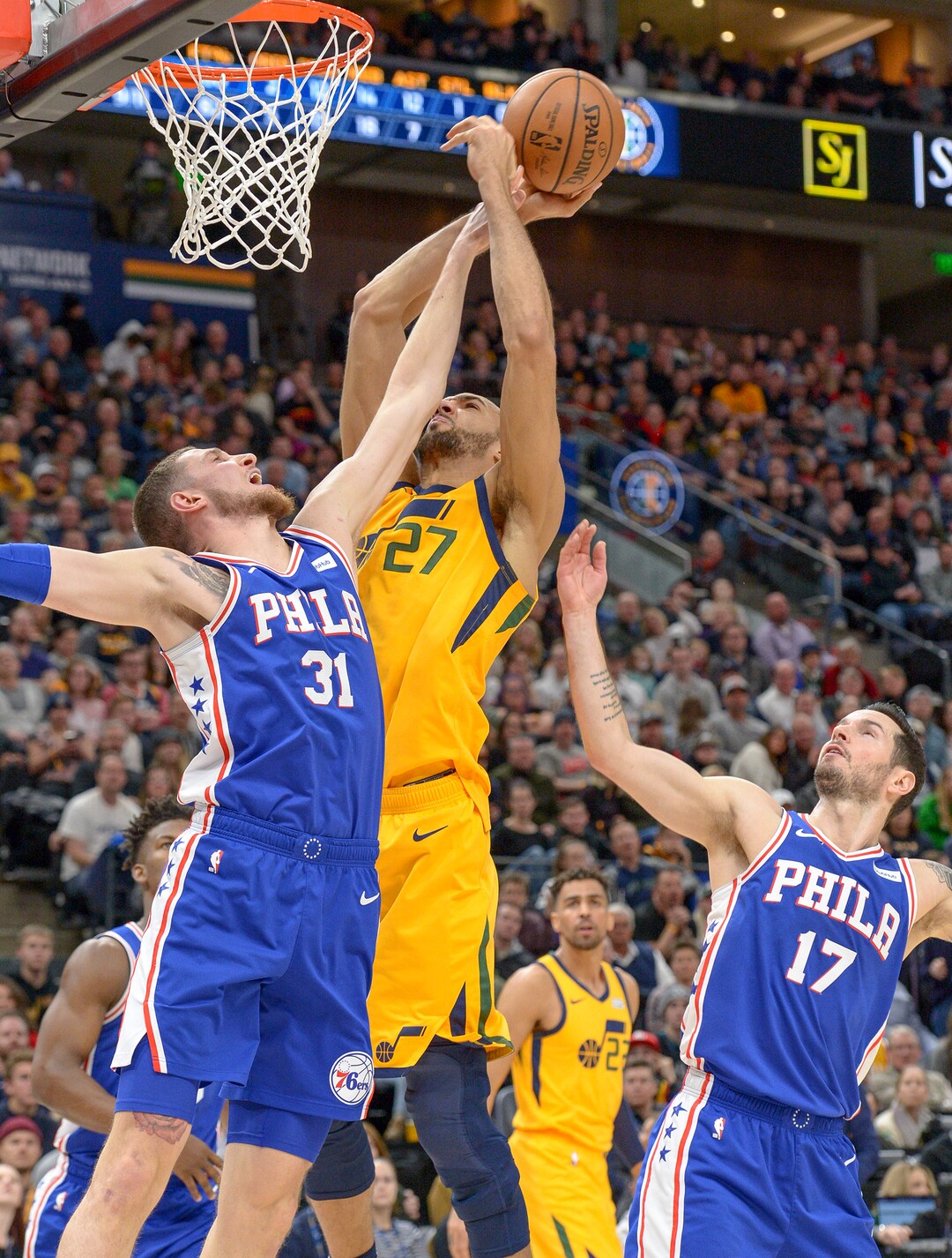 Leah Hogsten  |  The Salt Lake Tribune Utah Jazz center Rudy Gobert (27) shoots past Philadelphia 76ers forward Mike Muscala (31) as the Utah Jazz host the Philadelphia 76ers at Vivint Smart Home Arena, Thursday, December 27, 2018. 