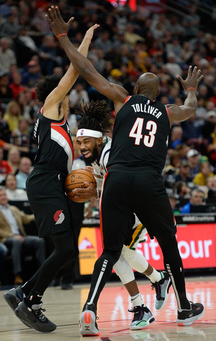 (Francisco Kjolseth  |  The Salt Lake Tribune)  Utah Jazz guard Mike Conley (10) gets stuck between Portland Trail Blazers guard Anfernee Simons (1) and Portland Trail Blazers forward Anthony Tolliver (43) as the Utah Jazz host the Portland Trailblazers in their NBA basketball game at Vivint Smart Home Arena in Salt Lake City on Wed. Oct. 16, 2019.