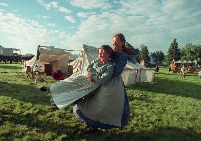 Rick Egan  | Tribune File Photo 

Wendy Westergard swings Amy Proud, as they take a break after along day on the trail in Wyoming. 