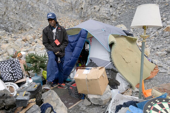 (Al Hartmann  |  The Salt Lake Tribune) 	
Ronald Ross has lived in a clean, well organized tent camp for about six months on the rocky mountainside above Victory Road north of the state Capitol building. He has a generator for lights and a television.  He is waiting for a birth certificate so that he can get an identification card to apply for a job.  Salt Lake City Police, Volunteers of America, Utah Highway Patrol, and social workers from Salt Lake City and the Veterans Administration had set up a mobiie outreach center along Victory Road.
