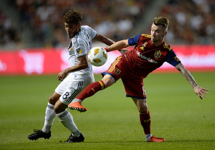 (Francisco Kjolseth  |  The Salt Lake Tribune)  Los Angeles Galaxy forward Ola Kamara (11) battles Real Salt Lake midfielder Sunday Stephen (8) during the first half of the MLS soccer match Saturday, Sept. 1, 2018, in Sandy at Rio Tinto Stadium.