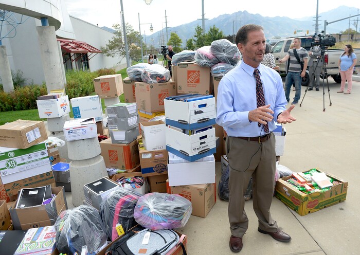 (Al Hartmann | The Salt Lake Tribune)
Rep. Chris Stewart stands with school supplies donated by citizens from his district for refugee students at Salt Lake Community College's Medowbrook campus in South Salt Lake Tuesday August 22. He later hosted a roundtable discussion with local refugees.