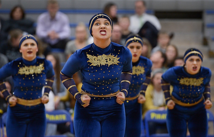 (Leah Hogsten | The Salt Lake Tribune) Brook Edwards and her fellow team members of the Spinnakers drill team, famous for using sabres in its routines, is celebrating its 50th season, performing in front of Cyprus High School boosters. Cyprus High School has grown and changed since the gym and what may be the state's oldest operating indoor pool were constructed in 1955. A new school is in the works, badly needed to accommodate a growing population on the west side's close-knit community, where long-time fans show up no matter how good or bad the Pirates are.