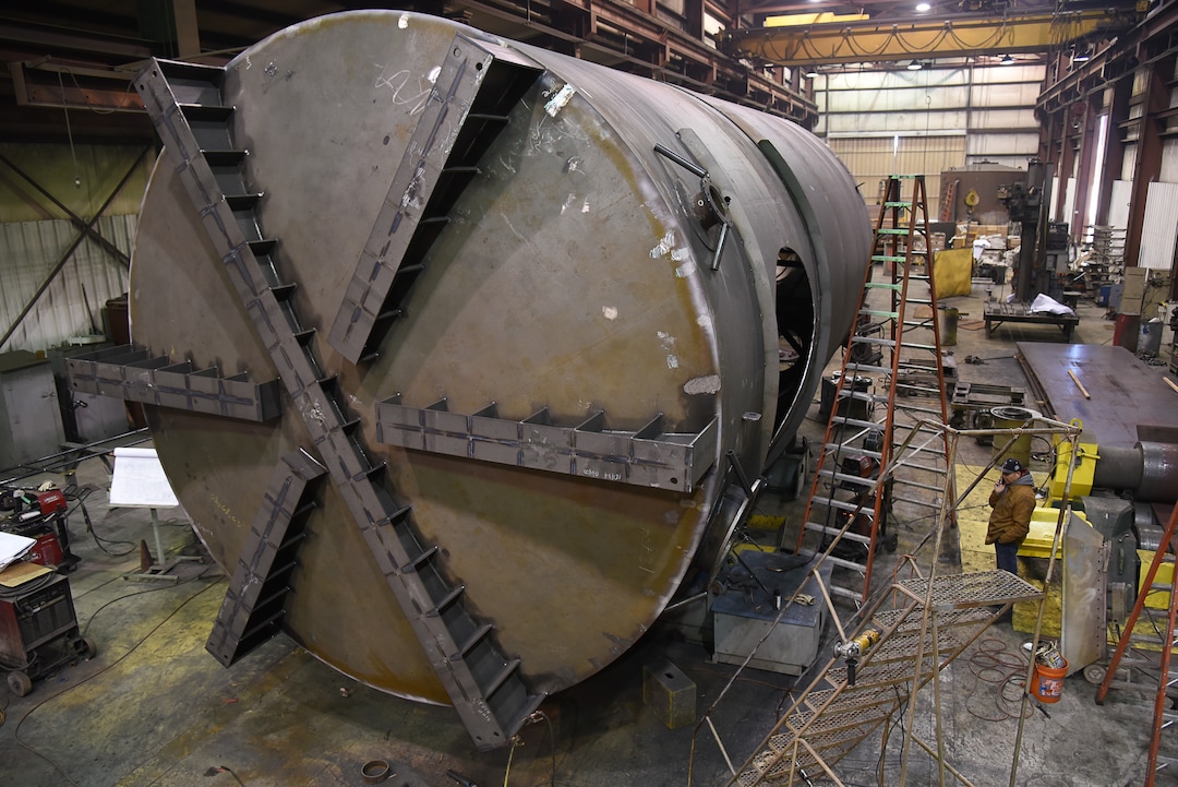 (Francisco Kjolseth  |  The Salt Lake Tribune)  Crews work on a large drying tower bound for a gold mine in Nevada at Structural Steel and Plate Fabrication in North Salt Lake on Friday, Dec. 28, 2018. Recent metal tariffs implemented by the Trump administration though a boom for steel producers has negatively impacted metal fabrication businesses creating numerous challenges. 