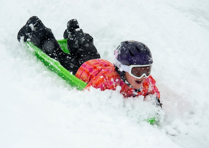 (Rick Egan  |  The Salt Lake Tribune)      
Desmond Fehlberg 7, sleds down the hill at Popperton Park, Monday, Jan. 21, 2019.



