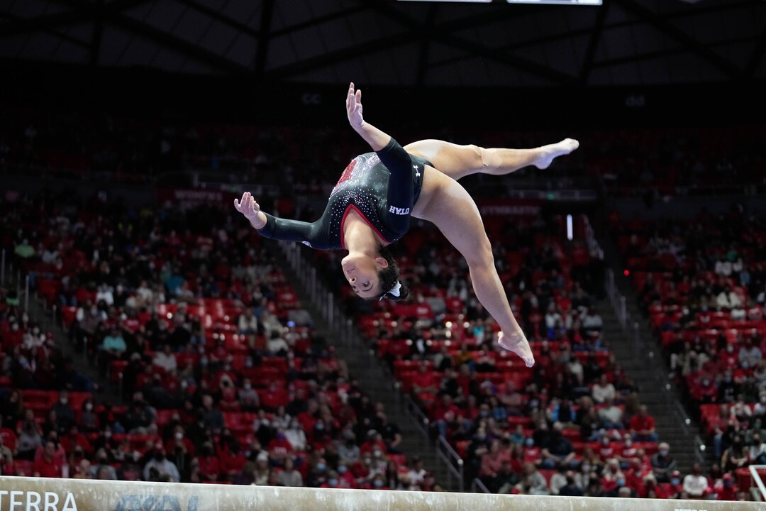 (Francisco Kjolseth | The Salt Lake Tribune) Utah’s Alexia Burch performs an exhibition routine on beam during their gymnastics meet with Stanford at the Huntsman Center in Salt Lake City, Saturday, Jan. 29, 2022.