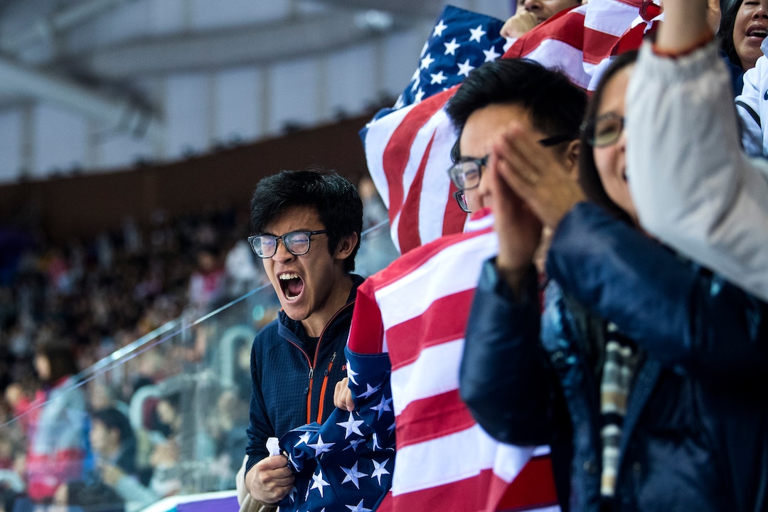 (Chris Detrick  |  The Salt Lake Tribune)  Nathan Chen's brother Colin Chen cheers along with other members of his family as the score is announced in the Men Single Skating Free Skating at Gangneung Ice Arena during the Pyeongchang 2018 Winter Olympics Saturday, Feb. 17, 2018. Chen landed a record six quadruple jumps, scoring 215.08.
