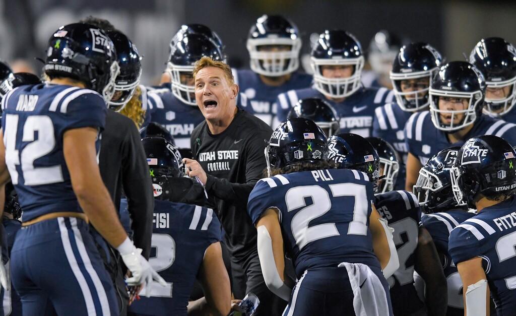 (Eli Lucero | The Herald Journal via AP) Utah State head coach Blake Anderson talks to players during a timeout in the second half against Colorado State on Saturday, Oct. 7, 2023, in Logan, Utah.