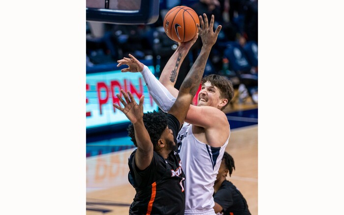 (Rick Egan | The Salt Lake Tribune)  Brigham Young Cougars center Richard Harward (42) shoots as Pacific Tigers forward Jordan Bell (1) defends, in overtime basketball action, between the Brigham Young Cougars and the Pacific Tigers, at the Marriott Center in Provo, on Saturday, Jan. 30, 2021.