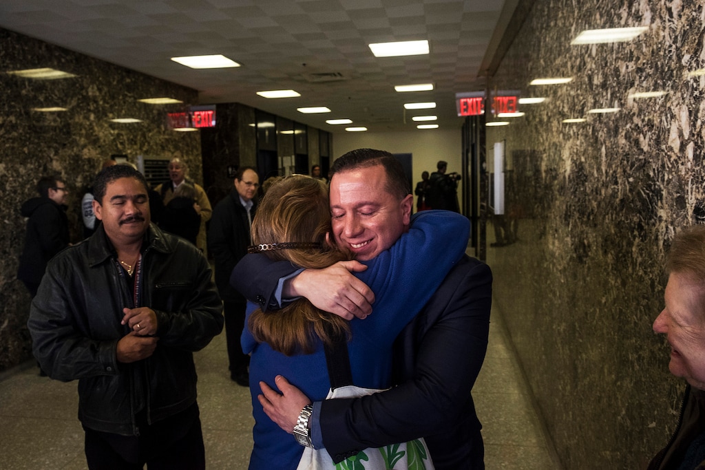 (Christian Hansen | The New York Times) Johnny Hincapie, right, who spent 25 years in prison, after a court dropped his case in New York, Jan. 25, 2017. Hincapie said he was beaten and coerced into making a false confession by a detective who convinced him that admitting a minor role in the crime would allow him to go home and receive lenient punishment.