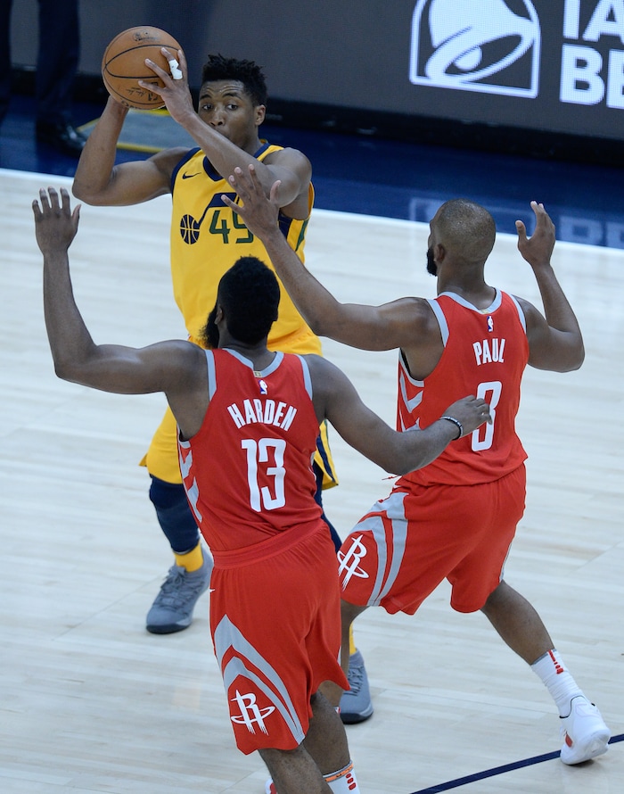 (Francisco Kjolseth | The Salt Lake Tribune) Utah Jazz guard Donovan Mitchell (45) faces a wall with Houston Rockets guard James Harden (13) and Houston Rockets guard Chris Paul (3) in Game 4 of the NBA playoffs at the Vivint Smart Home Arena Sunday, May 6, 2018 in Salt Lake City. Houston took a 3-1 series lead over the Jazz with a final score of 100 to 87.