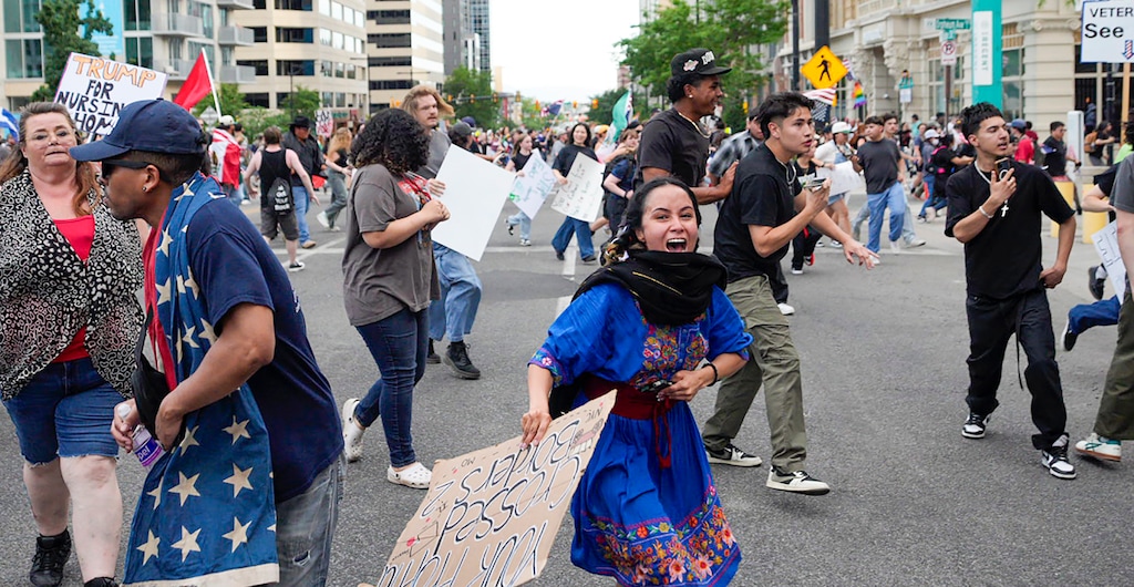 (Trent Nelson | The Salt Lake Tribune) The crowd reacts to the sound of gunfire during a demonstration in Salt Lake City, Saturday, June 14, 2025. Police say one person was critically injured during the "No Kings" march as part of national protests Saturday.