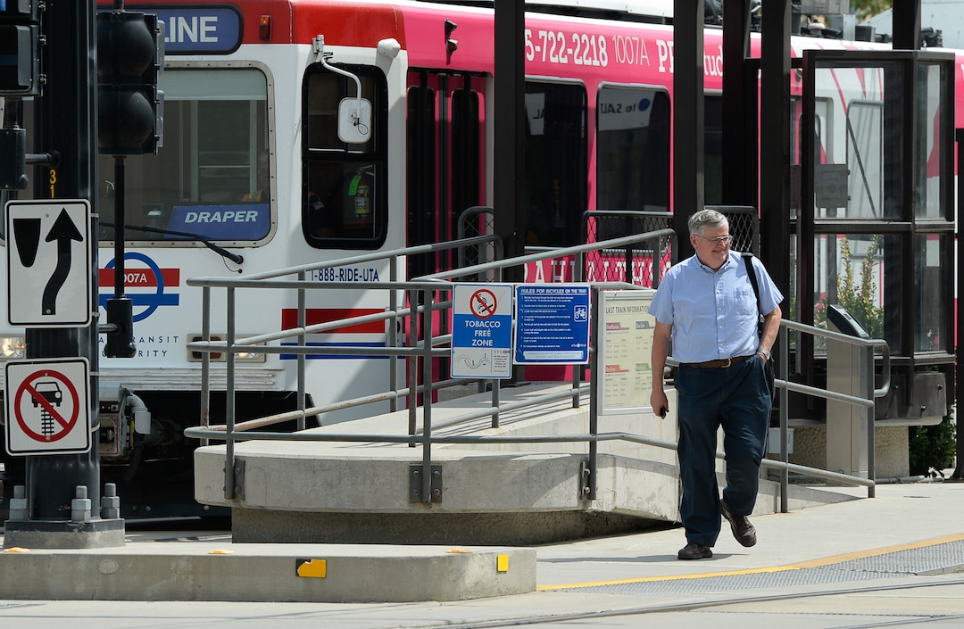 (Francisco Kjolseth  |  The Salt Lake Tribune)  Salt Lake Tribune writer Lee Davidson finishes his race against colleagues after using TRAX in a transportation race from Library Square to the Tribune building at the Gateway on Thursday, Aug. 2, 2018. Modes of transportation included, rentable electric scooters, Green Bike, TRAX, Lyft, and walking.