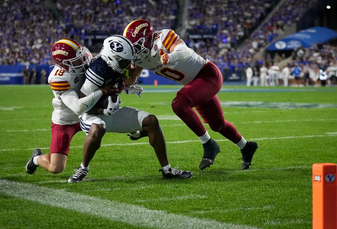 (Bethany Baker  |  The Salt Lake Tribune) Iowa State Cyclones safety Eddie Lemos (19) tackles BYU Cougars wide receiver Legend Glasker (1) assisted by Iowa State Cyclones linebacker Carson Willich (10) during the game between the BYU Cougars and the Iowa State Cyclones in Provo on Friday, Oct. 9, 2026.