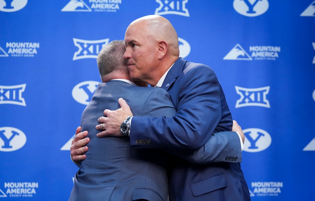 (Bethany Baker | The Salt Lake Tribune) BYU President Shane Reese, left, embraces Brian Santiago at the conclusion of a press conference following the announcement of Santiago as the new BYU athletic director at Brigham Young University in Provo on Wednesday, May 14, 2025.