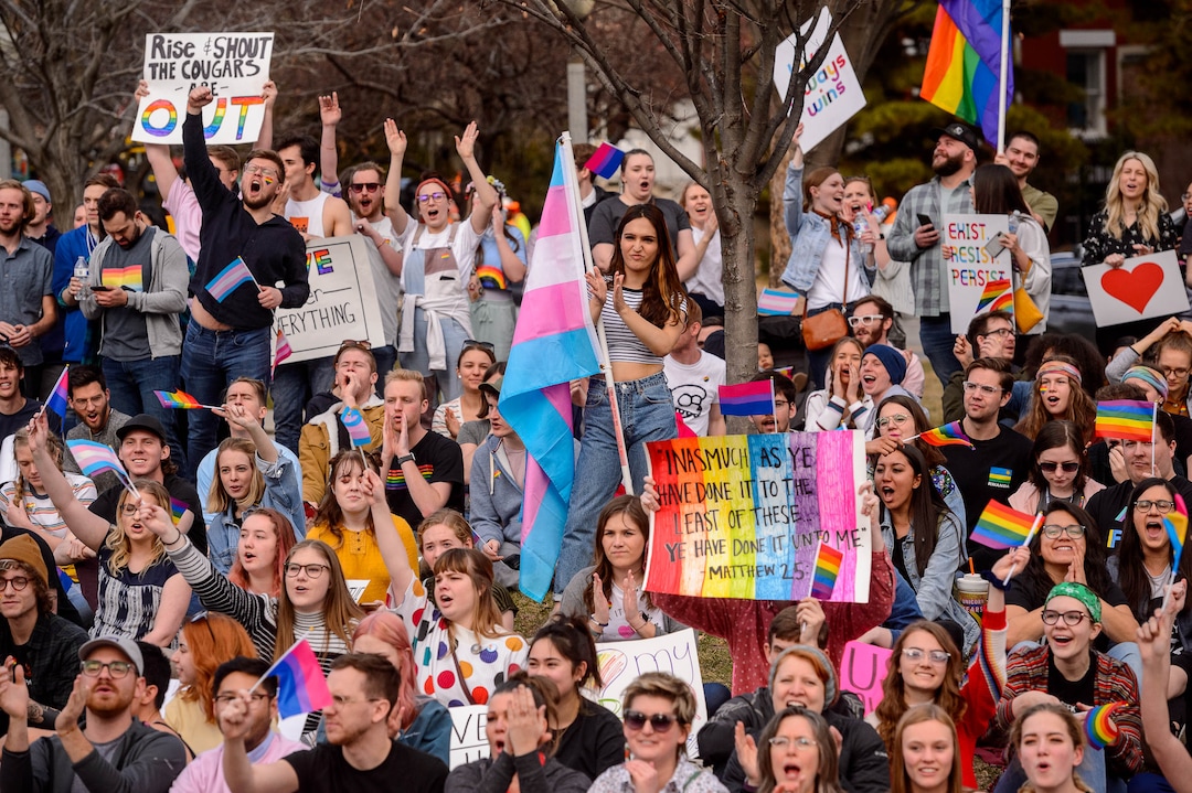 (Trent Nelson  |  The Salt Lake Tribune) Demonstrators at a rally about BYU's changing position on “romantic behavior” by same-sex couples gather in City Creek Park in Salt Lake City on Friday, March 6, 2020.