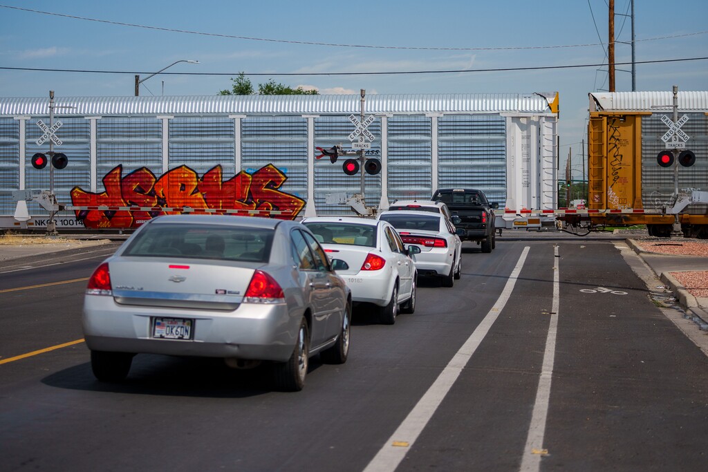 (Trent Nelson  |  The Salt Lake Tribune) A train stops, blocking traffic on 900 West in Salt Lake City on Thursday, Aug. 18, 2022. New signals may help commuters know how long it will take for trains to pass.