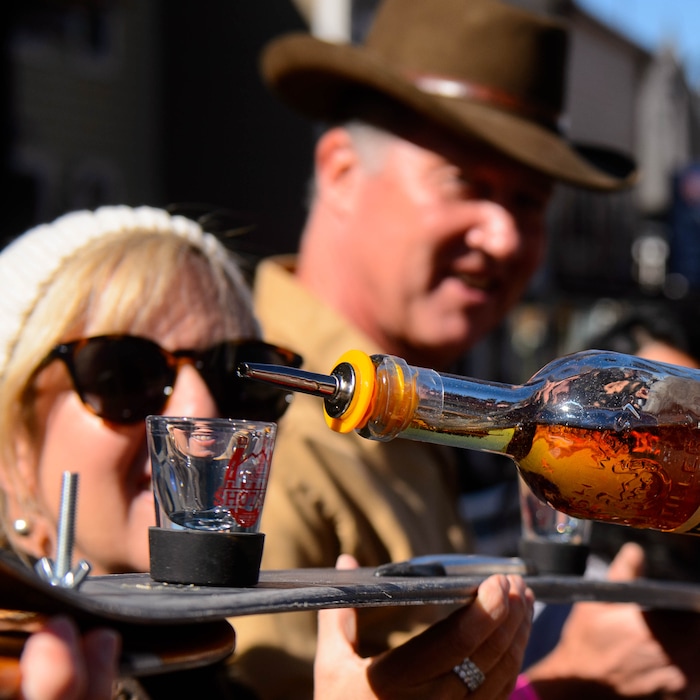 (Trent Nelson | The Salt Lake Tribune)
Participants line Park City’s Historic Main Street to throw one back at the annual Shot Ski event on Saturday Oct. 12, 2019.