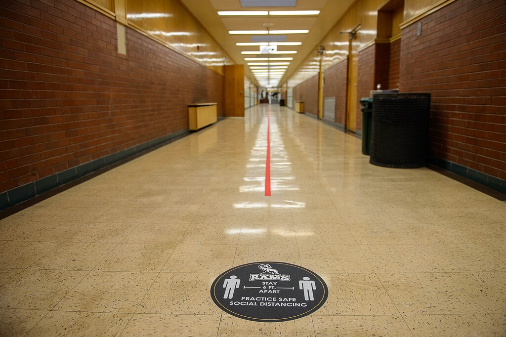 (Trent Nelson | Tribune file photo) This Feb. 8, 2021, file photo shows a social distancing marker in a hallway as students return to Highland High School in Salt Lake City. A tax-credit bill some saw as a school voucher bill fell short in the Utah Senate on Tuesday.
