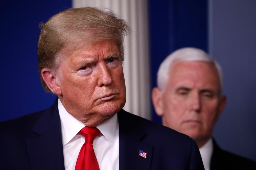 (Alex Brandon | AP) President Donald Trump and Vice President Mike Pence listen during a briefing about the coronavirus in the James Brady Briefing Room, Tuesday, March 24, 2020, in Washington.