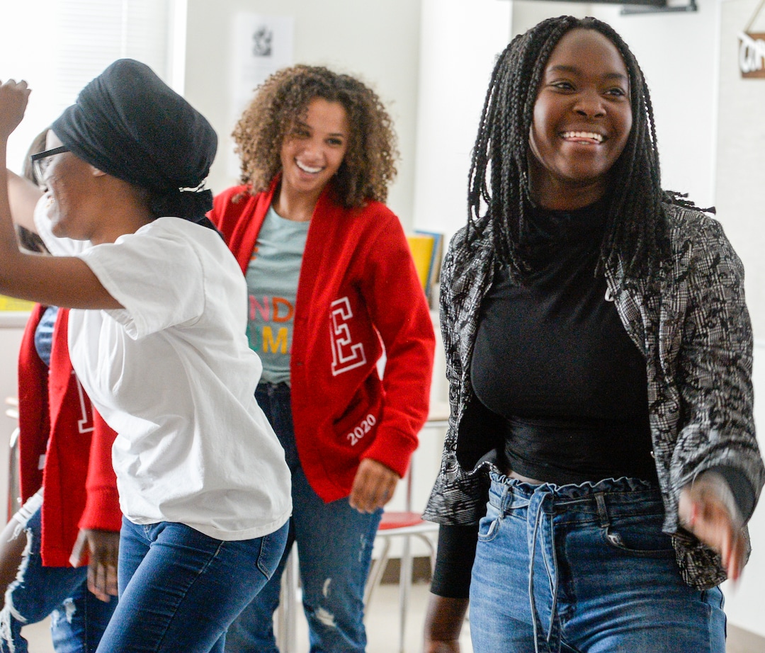 (Leah Hogsten  |  The Salt Lake Tribune) Aguilera Niyonkuru, left, Olivia Winston, center, and Rosine Nibishaka, right, members of East High School's Black Student Union, end their Sept. 18 meeting with a group dance.