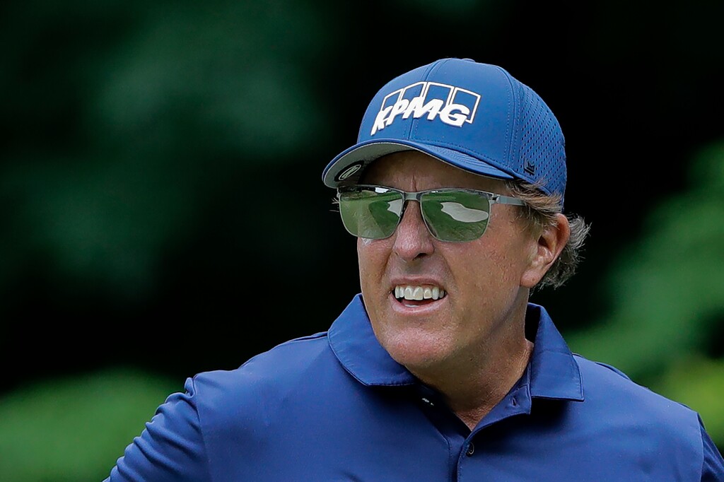 Phil Mickelson looks on after putting on the 14th green during the second round of the Travelers Championship golf tournament at TPC River Highlands, Friday, June 26, 2020, in Cromwell, Conn. (AP Photo/Frank Franklin II)