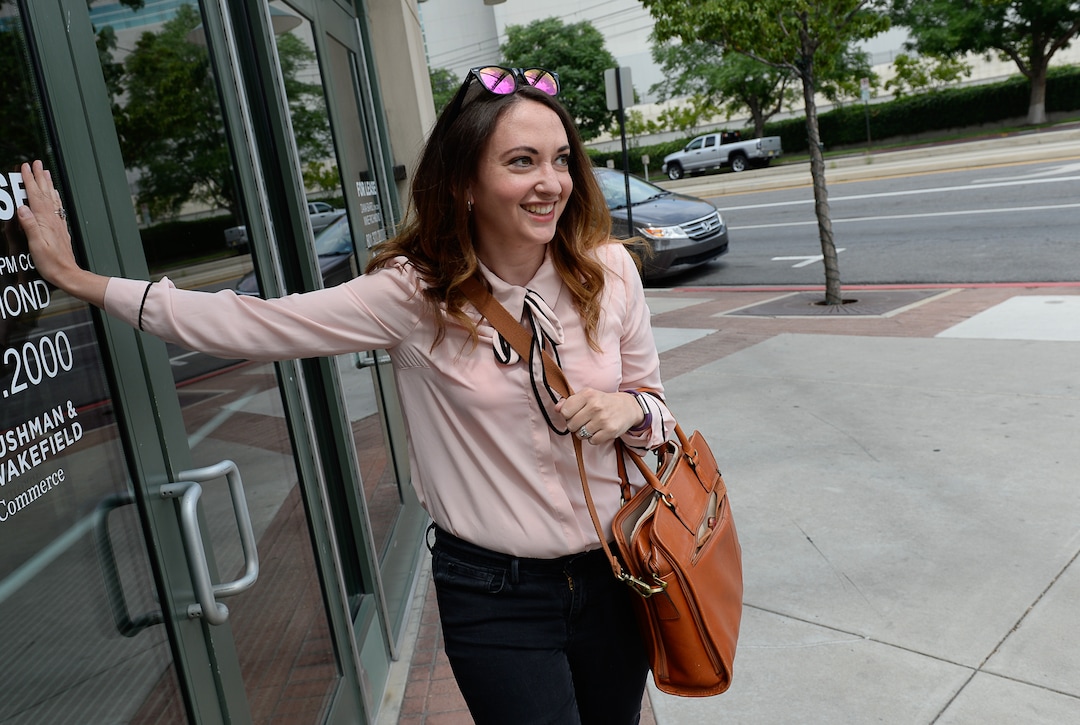 (Francisco Kjolseth  |  The Salt Lake Tribune)  Salt Lake Tribune Digital News Editor Rachel Piper finishes her race against colleagues after taking Lyft during a downtown transportation race from Library Square to the Tribune building at the Gateway on Thursday, Aug. 2, 2018. Modes of transportation included, rentable electric scooters, Green Bike, TRAX, Lyft, and walking.