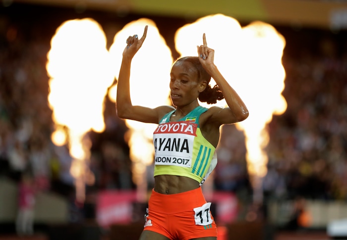 Ethiopia's Almaz Ayana celebrates as she crosses the line to take the gold in the women's 10,000 meter final during the World Athletics Championships in London Saturday, Aug. 5, 2017. (AP Photo/Matthias Schrader)